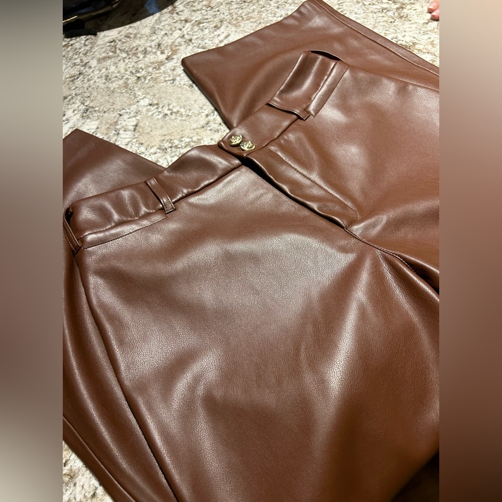 Womens Chico size 1 soft medium brown leather pants with gold button and zipper.